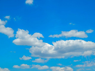 Blue sky with clouds and sun. blue sky