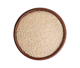 amaranth groats in a round clay plate, top view isolated on white