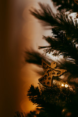 Closeup view of one beautiful christmas or new year fir tree decoration of angel toy on blurred background