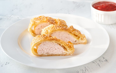 Sausage rolls with tomato sauce