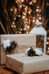 Christmas lantern and gift box over dark background. Christmas holiday celebration concept