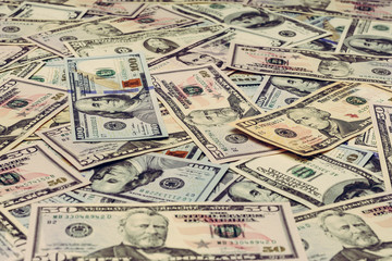 Fototapeta na wymiar Close up dollar texture, dollars in denominations of five, ten, twenty, fifty, one hundred 2019