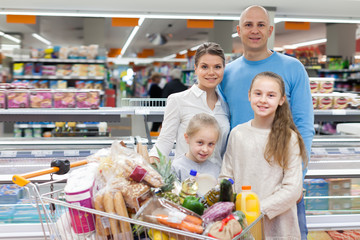 Ordinary kids and parents with purchases