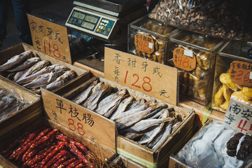 Fish and sausages for sale on street food market