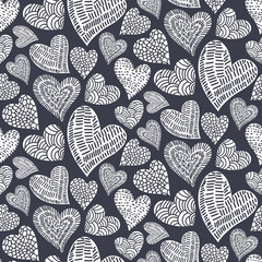 Romantic seamless pattern with cute images of hearts with hand drawn texture. The style of children's drawing.