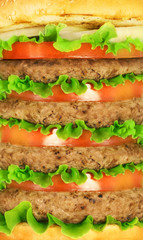 Burger stacked with tomato and lettuce