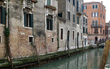 Fototapeta na wymiar The Springtime. Venice. Old buildings and bridge on street