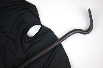 mask and crowbar on background