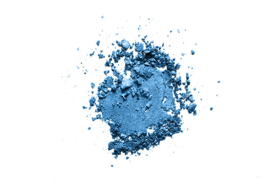 Broken eyeshadow, classic blue 2020 year color trend. Shimmer makeup powder swatch isolated on white background