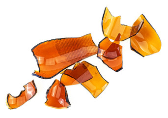 Pieces of broken brown glass isolated on white background. Top view.