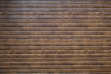 Brown wood texture outside used for fasading a house.