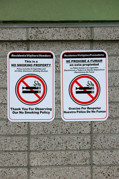 No Smoiking or Vaping area signs in English and Spanish