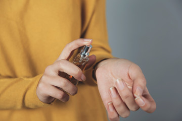 woman hand bottle of perfume