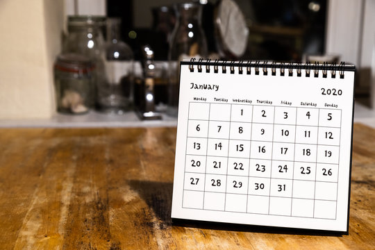 January 2020 Calendar - Month Page On Wooden Table In The Kitchen