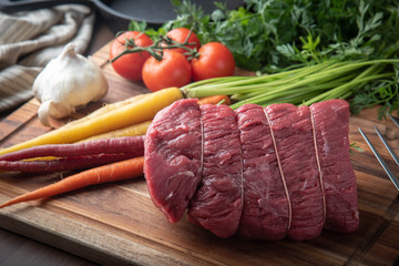 tied top round beef for roast beef with vegetable