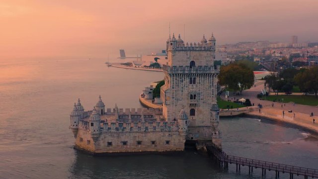 Lisbon, Portugal. Aerial circular view of the Belem Tower (Torre de Belem) at sunset