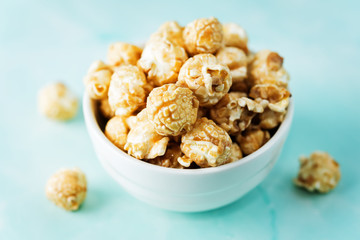 Caramel and chocolate sweet Popcorn in a white bowl