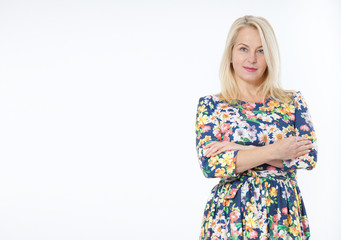 Middle aged woman in fashion blue dress portrait. Success. Isolated over white background.