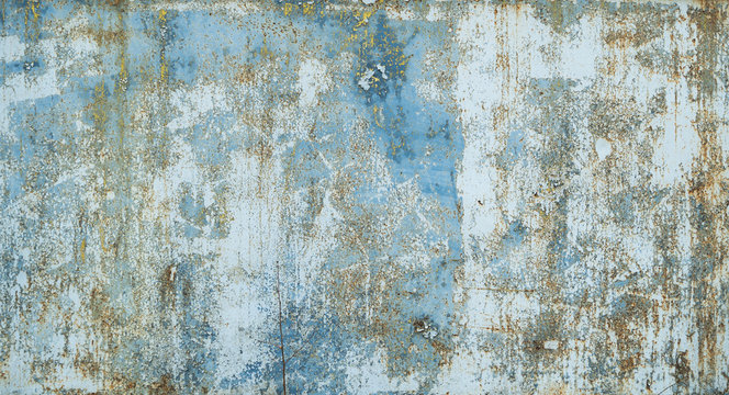 Painted in blue metal rusted background. Metal rust texture. Erosion metal. Scratched and dirty texture on outdoor rusted metal wall.