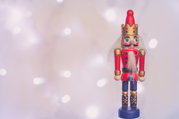 Wooden Nutcracker soldier Christmas decoration with sparkling  in background