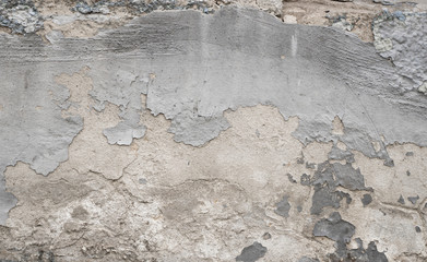 Fototapeta premium Cracked concrete grey wall covered with gray cement texture as background can be used in design. Dirty concrete texture with cracks and holes.