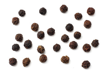 Black peppercorn isolated on white background. top view