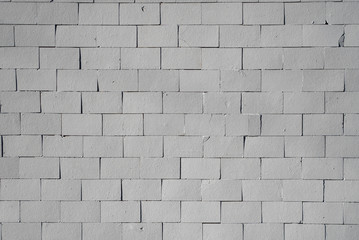 Grey vintage brick wall background or texture.