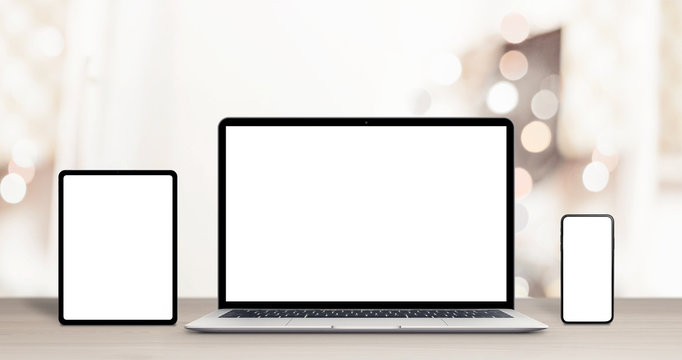 Phone, tablet and laptop computer mockup on work desk for responsive web design, or app promotion