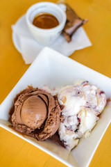 Chocolate and white cream ice cream and espresso coffee . Restaurant dessert