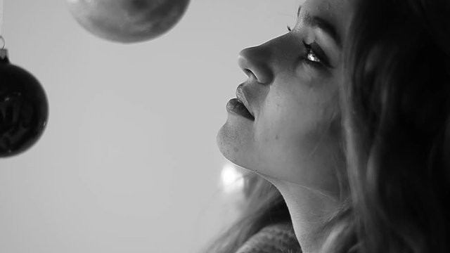 young woman blowing soap bubbles