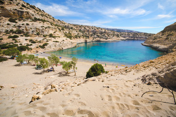 The small isolated gulf of Vathi, in Crete, with sandy beach and some lucky campers.