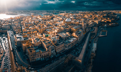 Fototapeta na wymiar City of Valletta, capital of Malta, aerial view, island in Mediterranean sea, dramatic sky