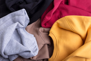 Concept colorful warm blank sweatshirts closeup