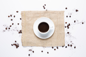 Obraz na płótnie Canvas white coffee cup , coffee beans on white background. Top view.