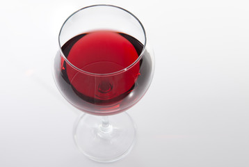 Glass of red wine with shadow.Top view