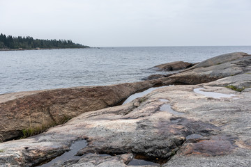 Sweden rocky sea side. Northern epic mystic cloudy grey landscape. Travel scandinavia