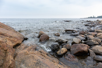 Fototapeta na wymiar Sweden rocky sea side. Northern epic mystic cloudy grey landscape. Travel scandinavia