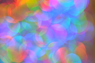 Shiny abstract background with festive defocused lights, colorful bokeh. Christmas or New Year holiday concept.