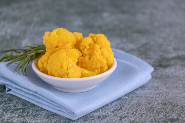 Fermented cauliflower with turmeric. Traditional healthy food. Copy space.