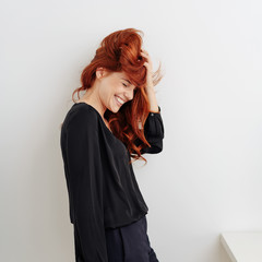 Fun young woman with tousled red hair