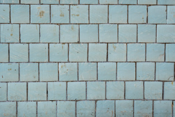 Naklejka premium Blue tiles on a wall as a background image.