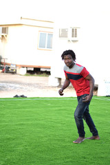 A Ghanaian African boy doing exercise and playing on the field Handsome fashionable fit & Healthy unique Hairstyle 
