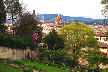 Fototapeta premium View of Boboli Gardens in Florence, Italy, with sculptures, blooming trees and flowers
