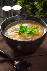 Hot mushroom soup with noodles. Small depth of field.