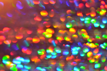 Shiny abstract background with festive defocused lights, colorful bokeh. Christmas or New Year holiday concept.