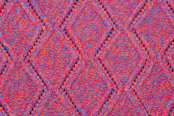 Fototapeta premium Knitted sweater texture. Pink melange rhombus pattern. Background. Copy space