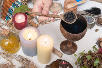 Witch doctor is preparing a magic potion close up.