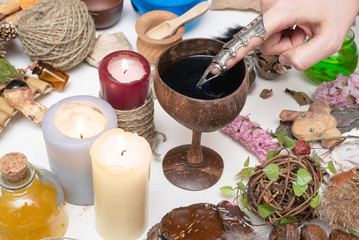 Witch doctor is preparing a magic potion close up.