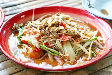 closeup of thai spicy papaya salad on table