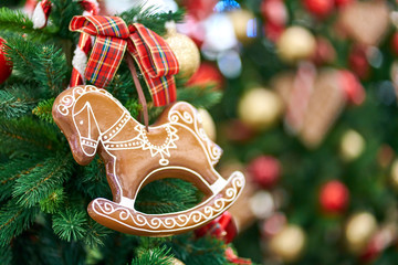 Christmas background - christmas gingerbread and branch of spruce tree